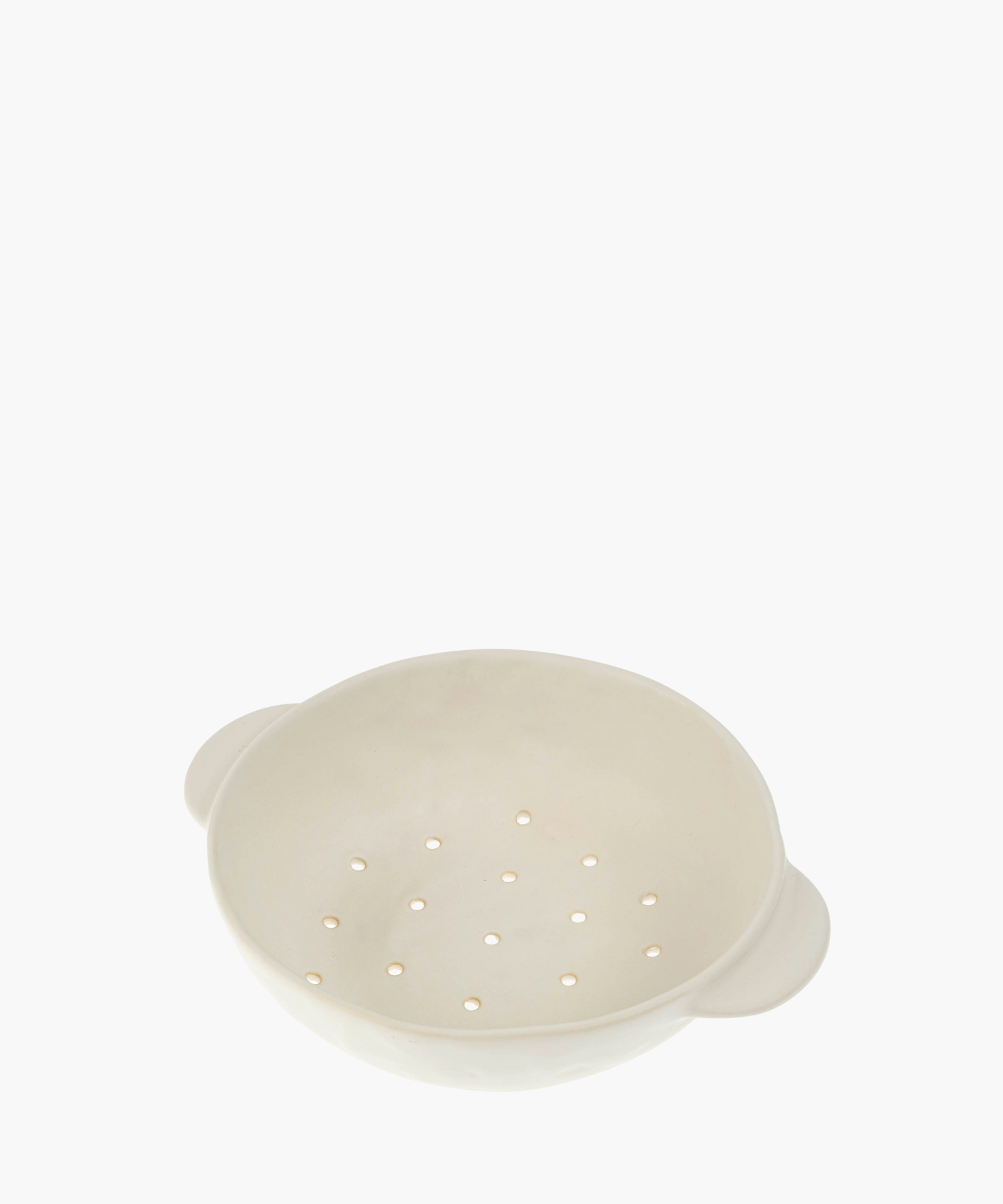 A white ceramic colander features a smooth finish and two handles, with evenly spaced drainage holes, conveying a minimalistic and functional design. | SW Home