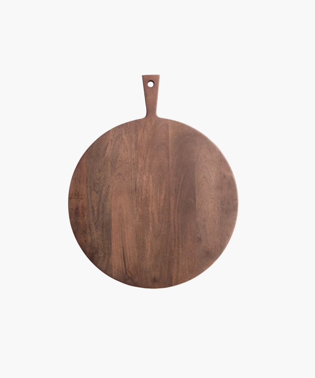 Round wooden cutting board with a rich, dark brown finish. It has a smooth surface and a handle with a hole at the top for hanging. | Wildwood Home Co.