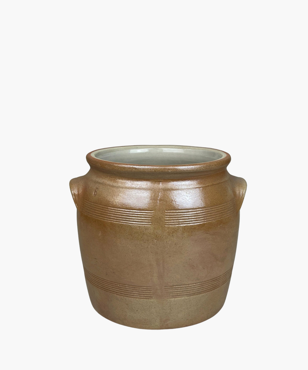 A rustic, brown salt crock with two small handles and horizontal etched lines. The pot has a smooth finish, conveying a simple, earthy elegance. | SW Home