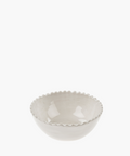 A white ceramic bowl with a glossy finish and a scalloped edge, set against a white background. The simple design conveys elegance and minimalism. | Wildwood Home Co.