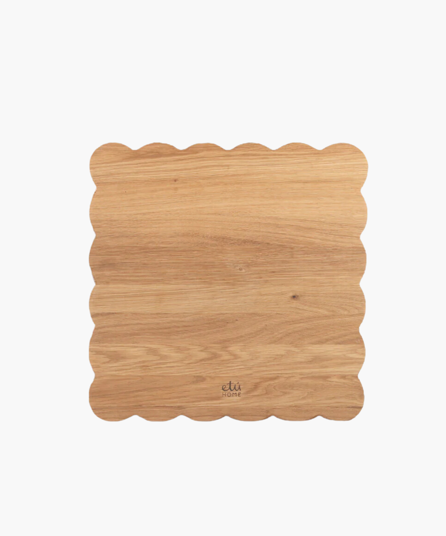Scalloped-edge wooden cutting board with a light oak finish. | SW Home