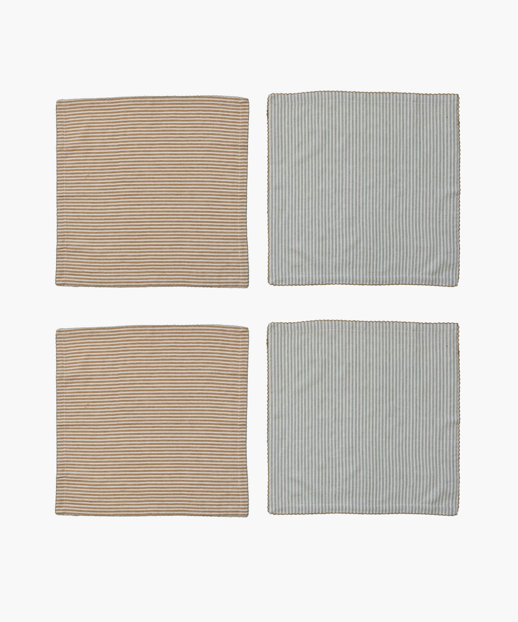 Four unfolded napkins with vertical stripes, two in beige and white, the other two in light blue and white. The edges have scalloped stitching.