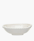 White ceramic colander with a rope-like textured rim and small dot detail pattern. The surface is smooth and glossy, exuding a simple, elegant feel. | Wildwood Home Co.